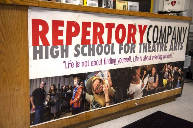 A sign upon entrance of Repertory Company High School for Theatre Arts advocates for student creativity and curiosity.