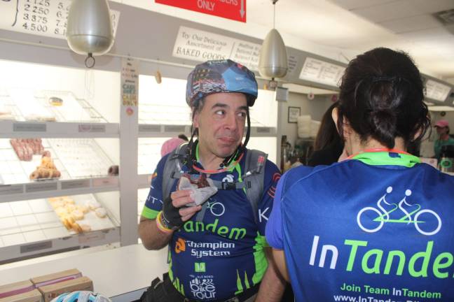 Cyclists at Peter Pan Donut &amp; Pastry Shop in Greenpoint, Brooklyn, the first stop during InTandem's Sept. 29 Late Night Donut Ride. Photo: Ariana Giulia Reichler