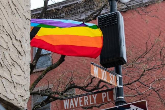 A pride flag flies in the breeze over the entrance to Julius’ Bar on the corner of West 10th Street and Waverly Place in Greenwich Village. Photo: Leah Foreman