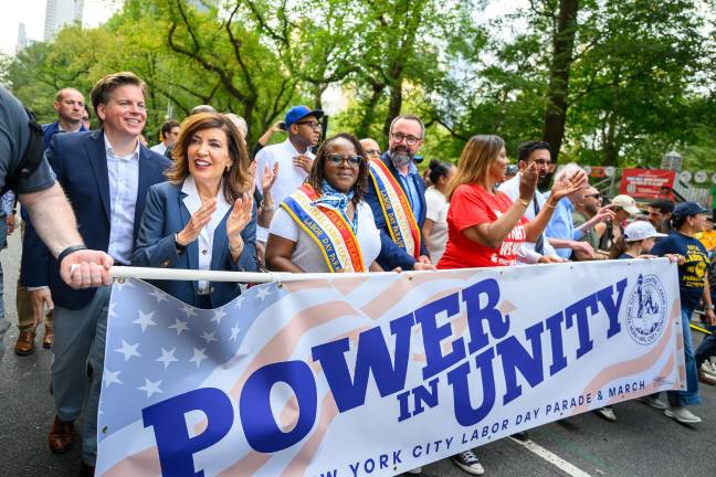 Governor Hochul, labor leaders, and other solons behind the banner at the NYC Labor Day Parade 2025.
