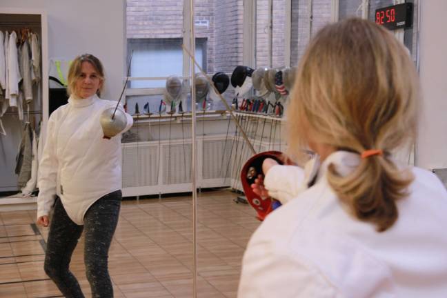 Reporter Genia Gould gets a fencing lesson the Upper West Side. Photo: Matt Casey