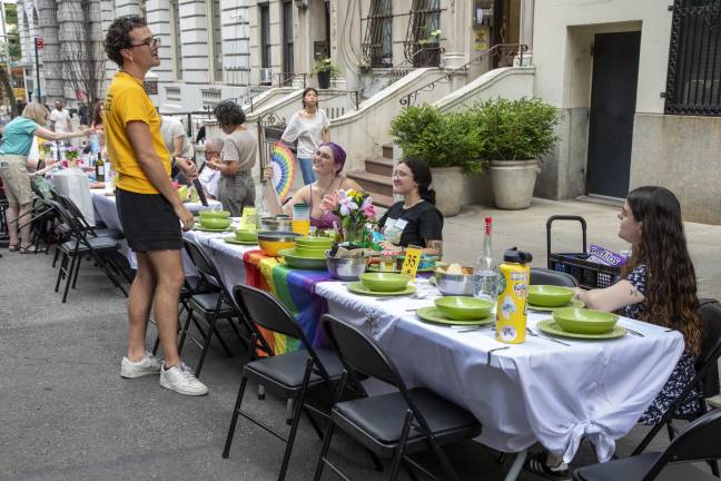 Neighbors brought a huge array of dishes, silverware, and table decorations to the event, sharing food from a variety of cuisines.