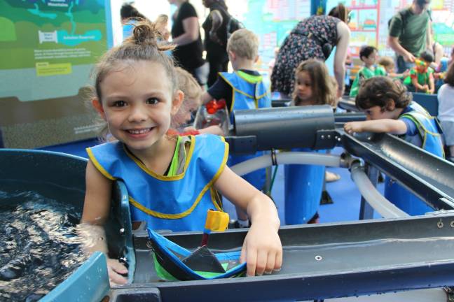 Kids learn about water — and get up close — at a summertime exhibit. Photo courtesy of the Children's Museum of Manhattan