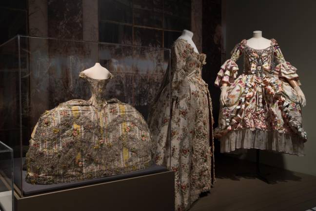 Mini re-creation of the Hall of Mirrors at Versailles, with, left to right: Fashion doll, 1760s, France. Fashion Museum, Bath. Robe à la française, circa 1755-1760, France. The Museum at FIT. John Galliano for Christian Dior, dress with underskirt and metal front piece, fall/winter 2000-2001, France. Christian Dior Couture.