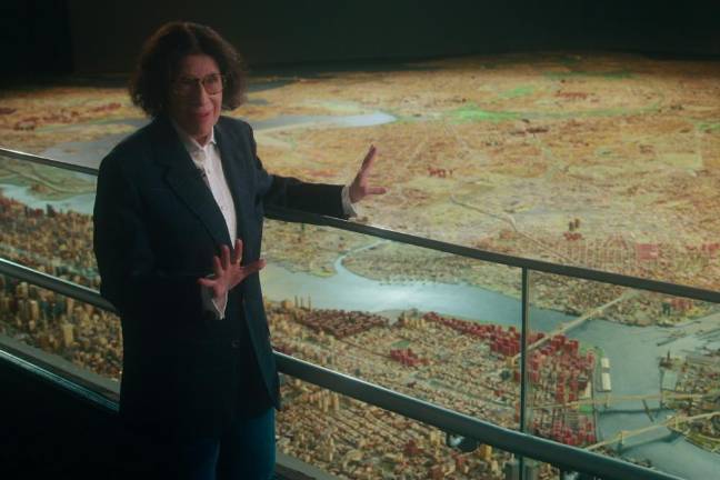 Fran Lebowitz by a 3-D model of New York, located inside The Queens Museum in Flushing Meadows-Corona Park. Photo courtesy of Netflix