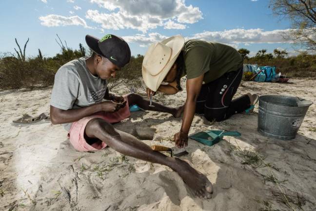 Archaeologists Ricky Justome (left) and Kristina Douglass excavating at the ancient village of Namonte, Mikea Forest, SW Madagascar. Photo: Garth Cripps, Morombe Archaeological Project