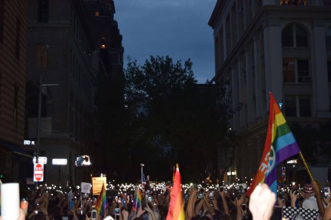 About 5,000 people attended a vigil near the Stonewall Inn on Monday evening that commemorated the lives lost in the mass shooting in Orlando. Photo: Isodro Camacho