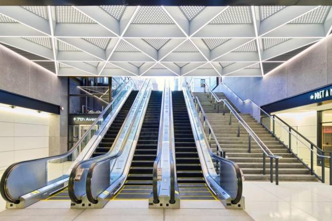 <b>The newly reopened Seventh Ave. entrance to Penn Station features three new escalators, up from two before the $600 million entranceway reconstruction.</b> Photo: Amtrak