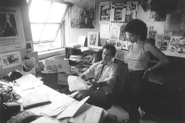 Tom Robbins works at City Limits with Annette Fuentes in an undated photo.