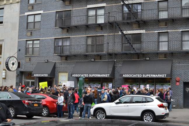 Chelsea residents protested last spring over the closure of one of the only affordable suppliers of fresh produce in the neighborhood after the supermarket's rent was drastically increased. Photo: Madeleine Thompson