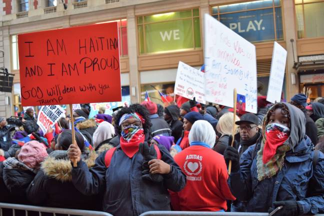 Hundreds of protesters, many of them Haitian-Americans, gathered in Times Square on Martin Luther King Jr. Day for an anti-racism rally following reports of President Donald Trump's disparaging comments about Haiti and other countries. Photo: Michael Garofalo