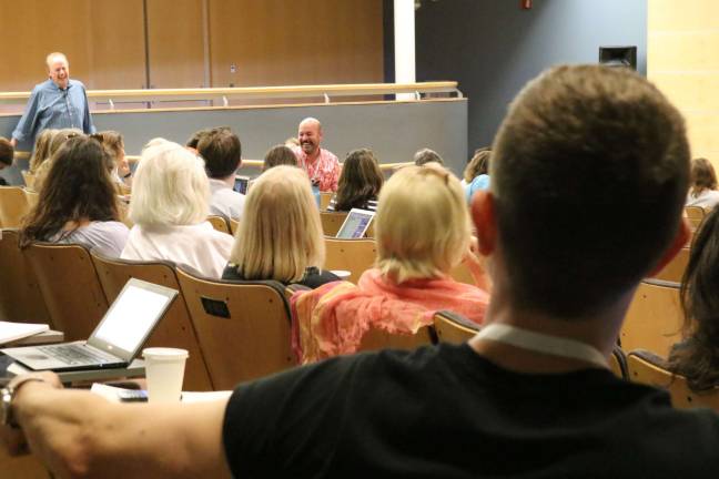 Author Roger Rosenblatt (left) shares a laugh at his memoir workshop at the Southampton Writers Conference. Photo courtesy of Southampton Writers Conference