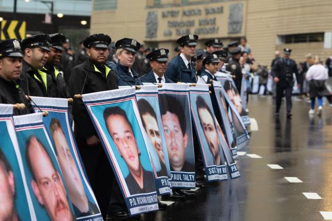 Banners of fallen 9/11 first responders await those exiting the Battery Tunnel in Manhattan.