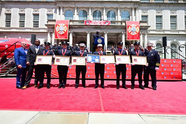6 members of Ladder Company 18 being awarded the World Trade Center Memorial Medal at FDNY Medal Day. From left to right, Nicholas P. Willoughdy, Dominic J. Torre, Lt. Kevin C. Alore, Jr, Capt. Brian M. Scimeme, Michael L. Morano and Justin C. Rodriguez