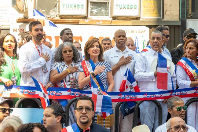 Hand on heart: Pols and VIPs during pre-parade ceremony for the Dominican Day parade on Aug. 10.