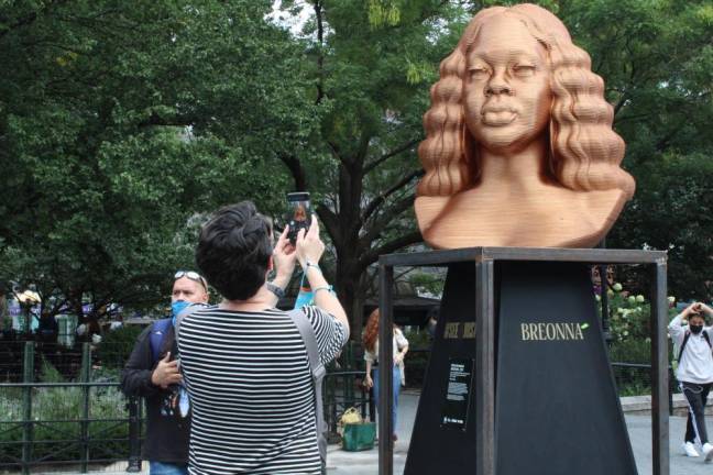 Visitors by the statue of Breonna Taylor. Photo: Gaby Messino