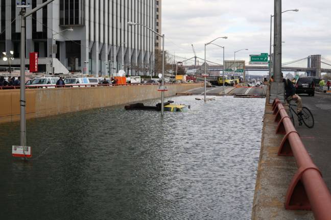 Hurricane Sandy flooding at Battery Park underpass. Photo: Timothy Krause, via flickr
