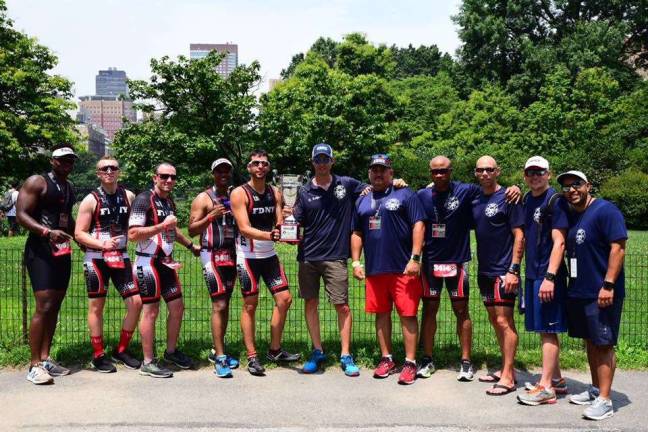 David Guilford (center with baseball cap) with other members of FDNY triathlon team. Photo courtesy of David Guilford.