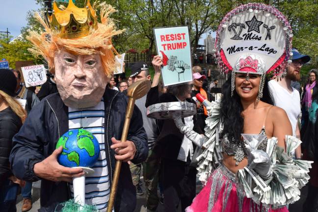 Anti-Trump protesters wore eye-catching costumes in response to Trump&#x2019;s visit to the Intrepid in May. Photo: Michael Garofalo