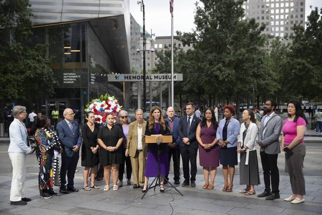 Speaker Julie Menin joins other elected representatives to reveal a $1 million funding initiative from the City Council for the 9/11 Memorial Museum and Tours exhibition.