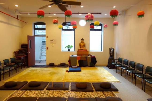 One of several interior spaces at the Zen Buddhist Temple on East 63rd Street &#x2013; under the lotus lanterns, in front of the central icon of the Buddha &#x2013; that followers use for meditation and chanting. The practice of meditating, Buddhists believe, is the direct path to freedom and enlightenment.&#xa0;Photo: Ben Henry /&#xa0;Zen Buddhist Temple