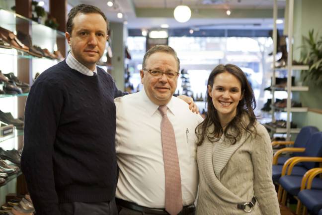 Danny Wasserman, center, with his children Lester and Margot, who all help run Tip Top Shoes. Photo by Mary Newman