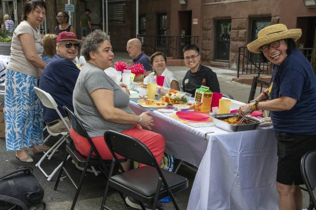 Members of the W 102 and 103rd community gathered along the street connecting Broadway and West End for the annual UWS ‘Longest Table’ event June 14.
