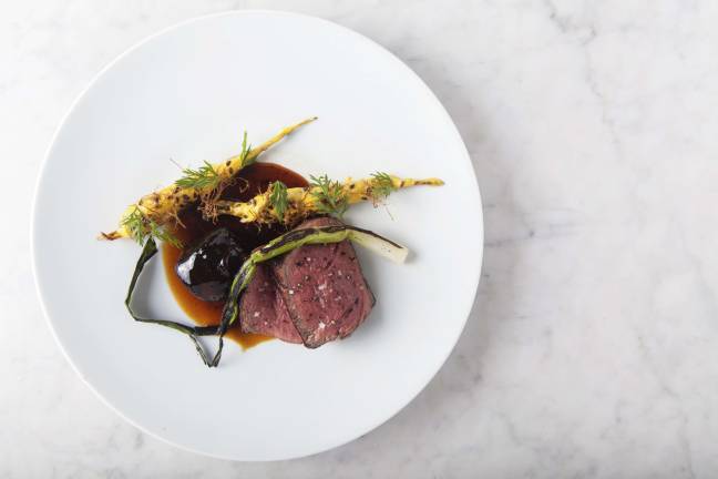 Dovetail beef filet. The beef filet and braised cheek at Dovetail, complete with carrot, cr&#xe8;me fraiche and scallion