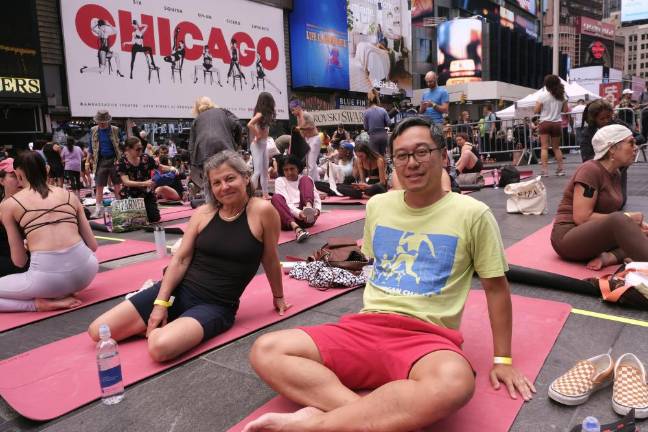 Tanya Khotin (left) and Paul Chhoy (right) coming out of Marco Rojas 1:30 p.m. class at Summer Solstice Yoga: Mind Over Madness event. Photo: Beau Matic