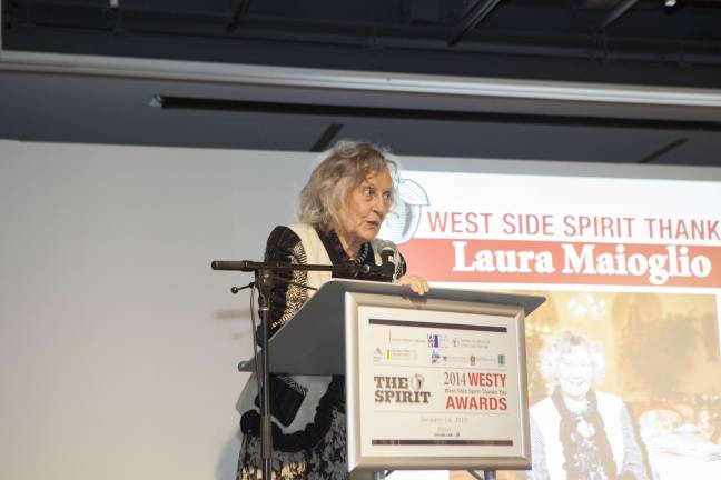Laura Maioglio, owner of Barbetta restaurant, accepts her WESYT Award and jokes with the audience that now her Nobel Prize-winning husband has something to be jealous of. Photo by Mary Newman