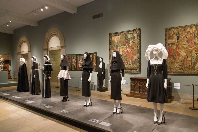 The Met's &#x201c;Heavenly Bodies: Fashion and the Catholic Imagination&#x201d; within the museum's Fifth Avenue Medieval Sculpture Hall. Photo: &#xa9; The Metropolitan Museum of Art