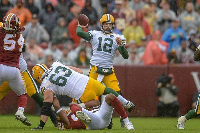 Green Bay Packers Aaron Rodgers tosses a pass vs Washington at Fedex Field. September 23th 2018. Photo: R Hildred, All Pro Reels, Wikimedia Commons
