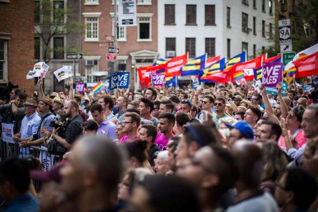 Hundreds gathered Sunday by the Stonewall Inn on Christopher Street, where the gay rights movement was launched in 1969. Photo: Adrian Cabrero, via Flickr