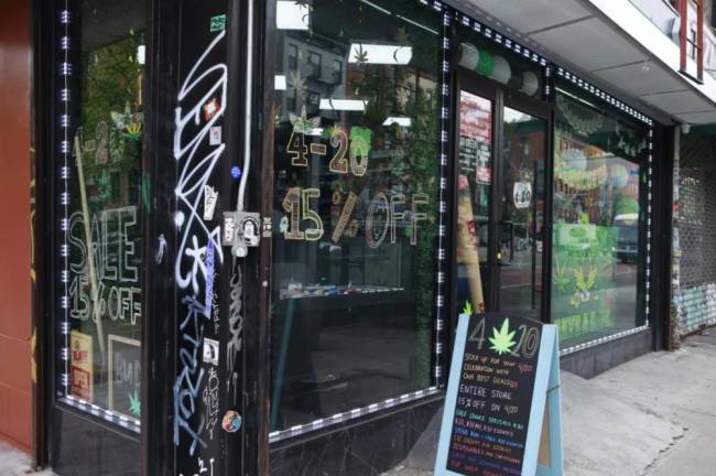 An unlicensed cannabis shop advertises specials for 4/20, April 19, 2024. Photo: Alex Krales/THE CITY