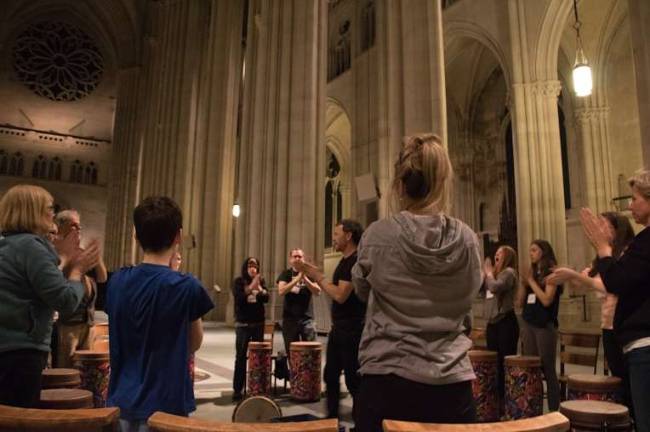 Danny O&#x2019;Brien leads a drum circle, warming everyone up with hand clapping exercises. Photo: Melody Chan