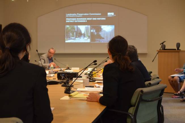 LPC Commissioner Michael Devonshire asks questions of the agency's research staff about the downsizing of a historic district extension. Photo by Daniel Fitzsimmons.