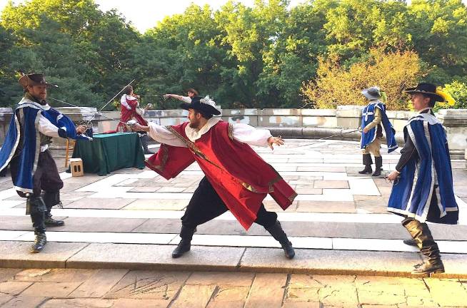 A scene from “The Three Musketeers,” staged by Hudson Warehouse on the north patio of the Soldiers’ and Sailors’ Monument in Riverside Park in July 2017. Photo: Susane Lee / Hudson Warehouse