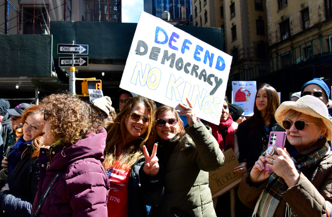 One young protestor at the “No Kings” demonstration in Manhattan on March 28 flashes a peace sign, a throwback to the street demonstrations against the Vietnam War in the late 1960s and early 1970s.