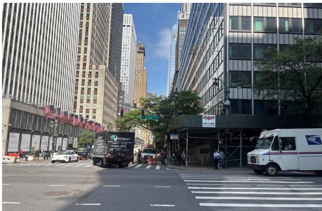 By Thursday, July 9, traffic was being allowed to pass in front of the stricken building (right) on East 42nd Street but traffic was still blocked on East 43rd Street, on the side of building closest to the buckled steel beams.