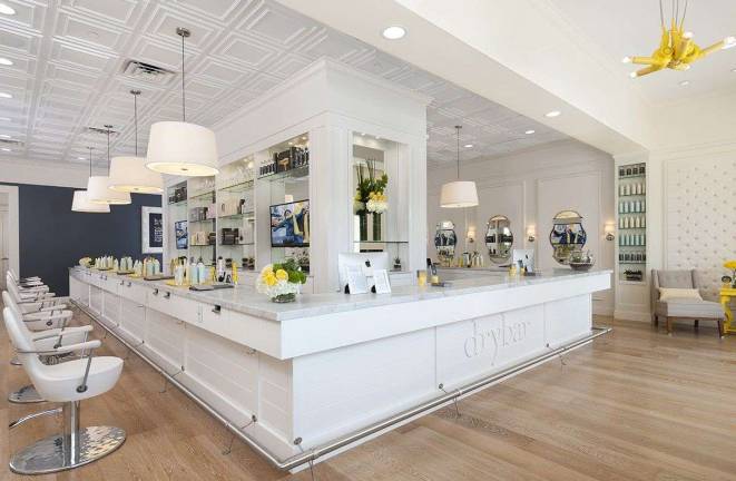 The interior of one of the Drybar locations, where customers can pick the blowout style they want