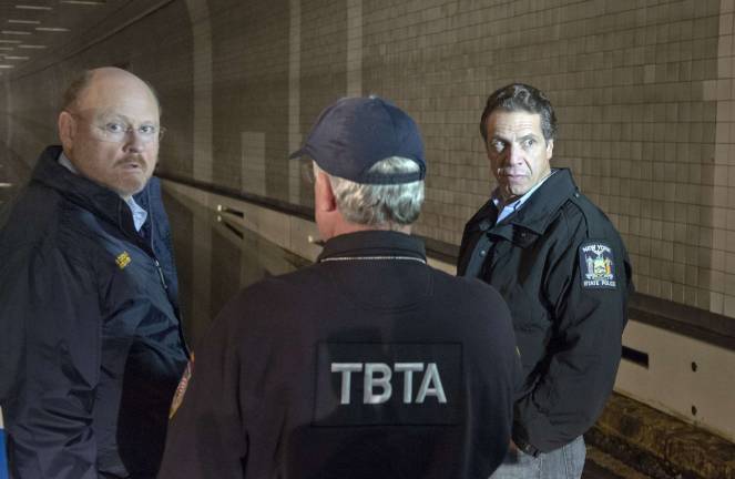 MTA Chairman Joseph Lhota (left) with Gov. Andrew Cuomo (right) in the flooded Brooklyn Battery Tunnel, Oct. 30, 2012. Photo: MTA / Patrick Casahin