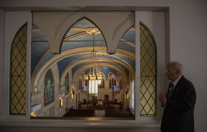 The Gothic chapel has an upstairs viewing room, which allows for livestream recording and for additional funeral participants.