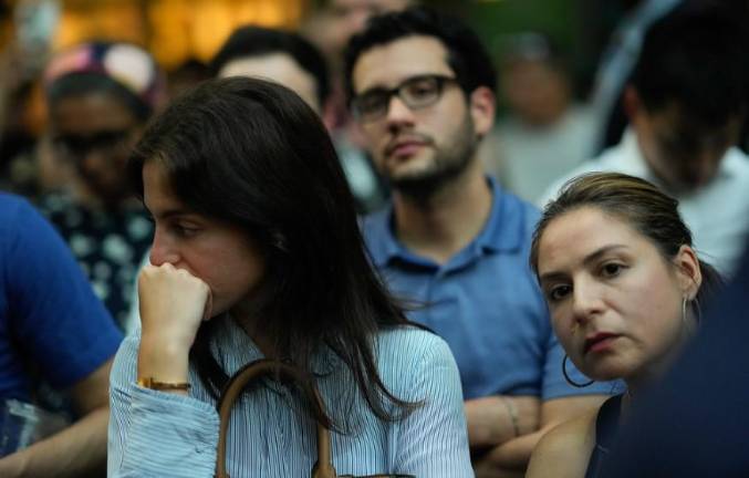 Mourners gathered in Bryant Park on July 29 to remember the four victims killed when a gunman armed with AR-15 style assault rifle invaded 345 Park Ave. and opened fire.