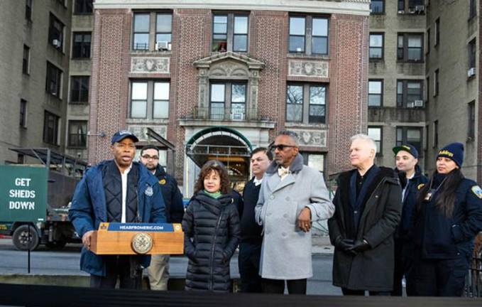 Mayor Eric Adams at 409 Edgecombe Ave., after scaffolding that had encased the landmarked building for 21 years, was removed as part of his Get Sheds Down initiative. Photo: Mayor’s Photography Office