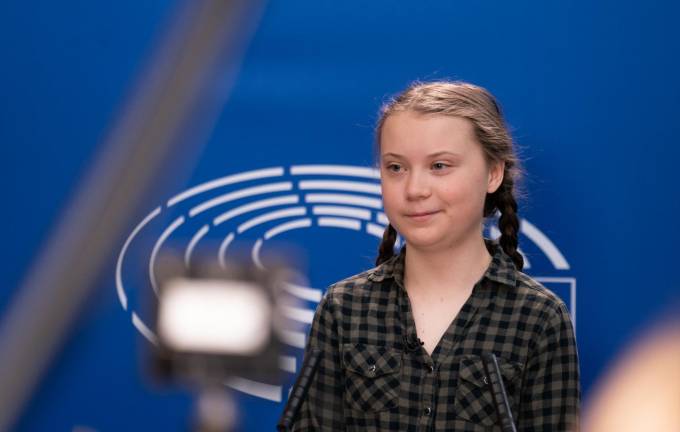 Trademark double-braids: Greta Thunberg at the European Parliament in April.