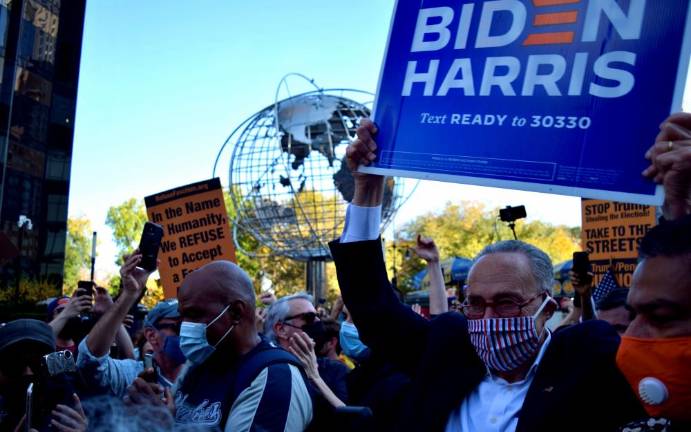 Sen. Chuck Schumer was swarmed as he appeared at Trump International Hotel at Columbus Circle on Saturday. Photo: Emily Higginbotham