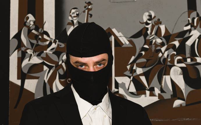 Masked artist Ryan Bock’s practice is rooted in a need for narrative structure, maintaining a fascination with shape, shade, shadow, structure, and optical illusion.