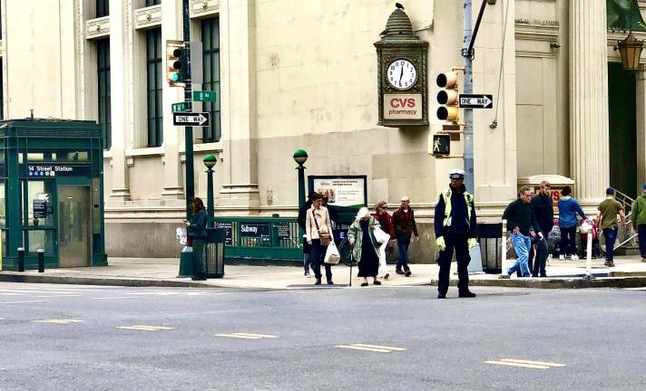 A traffic officer at the now-mellow intersection of 14th St. and Eighth Ave.