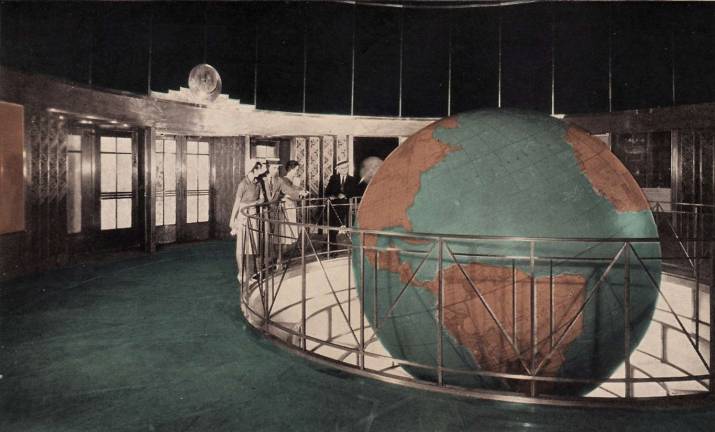 A colorized postcard image from 1941 shows the giant, 17-foot, gold-tinted rotating globe in the lobby of the old Daily News Building at 220 East 42nd Street. One of the world&#x2019;s largest indoor globes, it was used as a permanent educational science exhibit for schoolkids. Postcard: Published by Lumitone Photoprint, via Wikimedia&#xa0;Commons