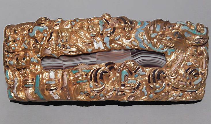 An ornamental plaque of agate, surrounded by golden and turquoise animals and dragons, bears witness to cultural influences from afar. Photo: Adel Gorgy